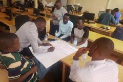 Participants working in groups during the training