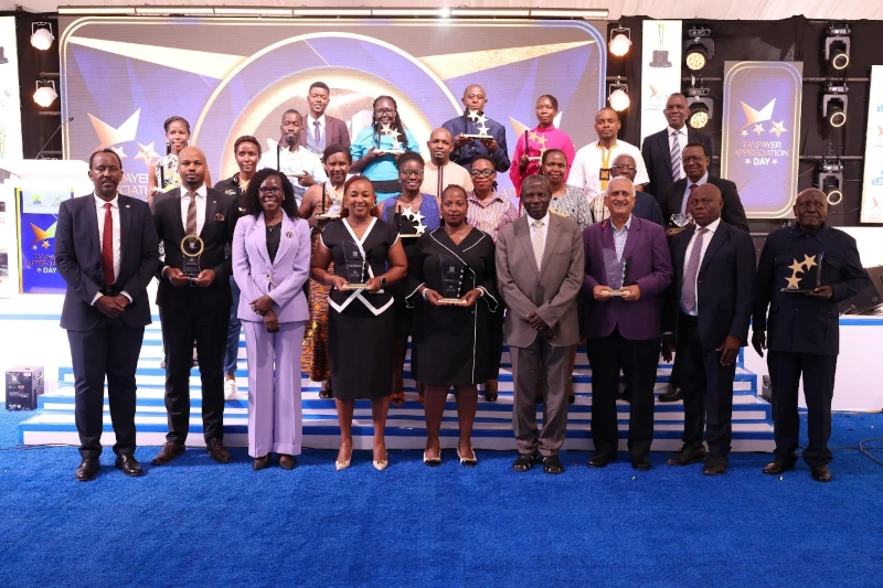 All Winners of the day: Second Left is The university Secretary Mr. Vincent Kansiime Kwatampora holding the MUST award.