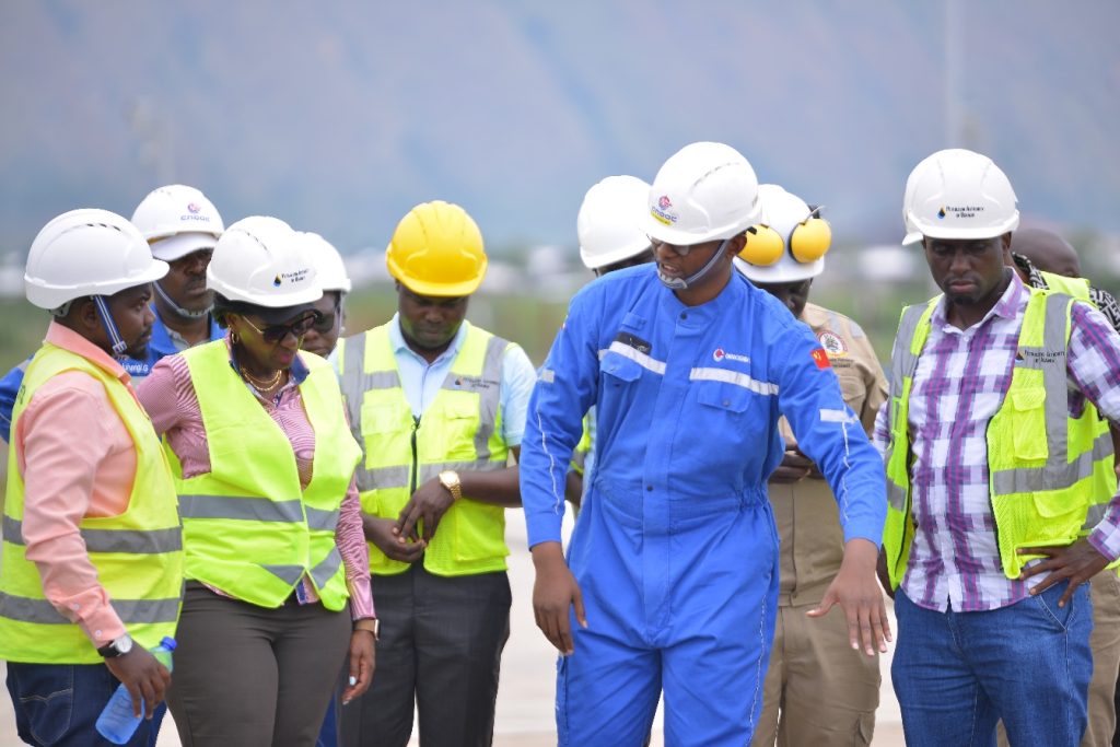 Top Management with alumni at Kingfisher oilfield pad 1 wells : L-R . Robert Bitariho DVC F&A, Eng. Asaph Mweheyo, FAST Alumnus Prof. Pauline Bykika-Kibwika Vice chancellor, Eng. Beeta Edwin FAST Alumnus and Prof. Joseph Ngonzi DVC AA
