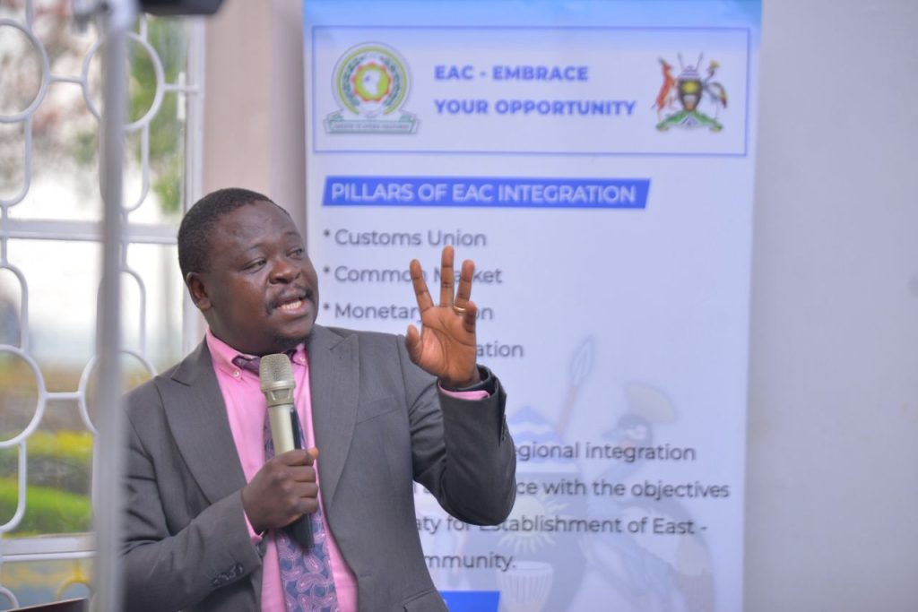 Dr. Andrew Musiime making a presentation 