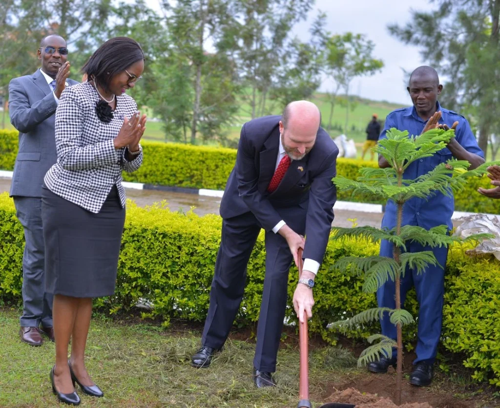 The Ambassador planted a commemorative tree in front of the Estates and Works Building at Kihumuro Campus 