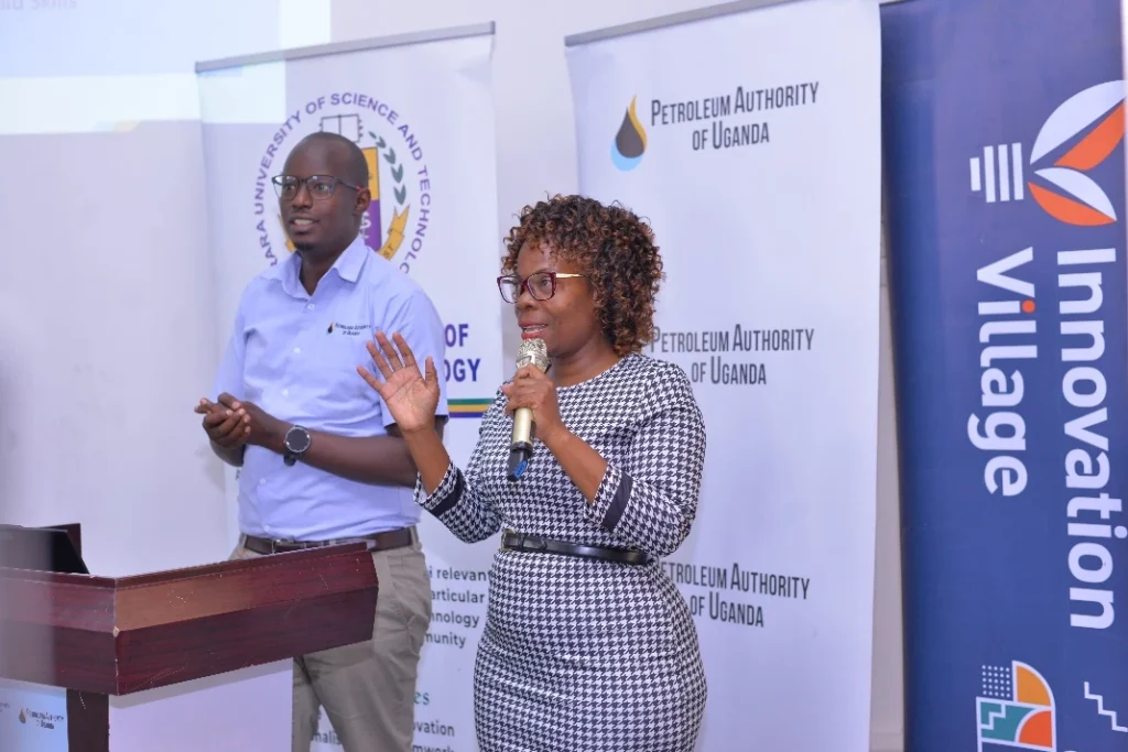 L: Mr. Seith Muhumuza (comms PAU) R:Angella Nakato (Comms MUST)